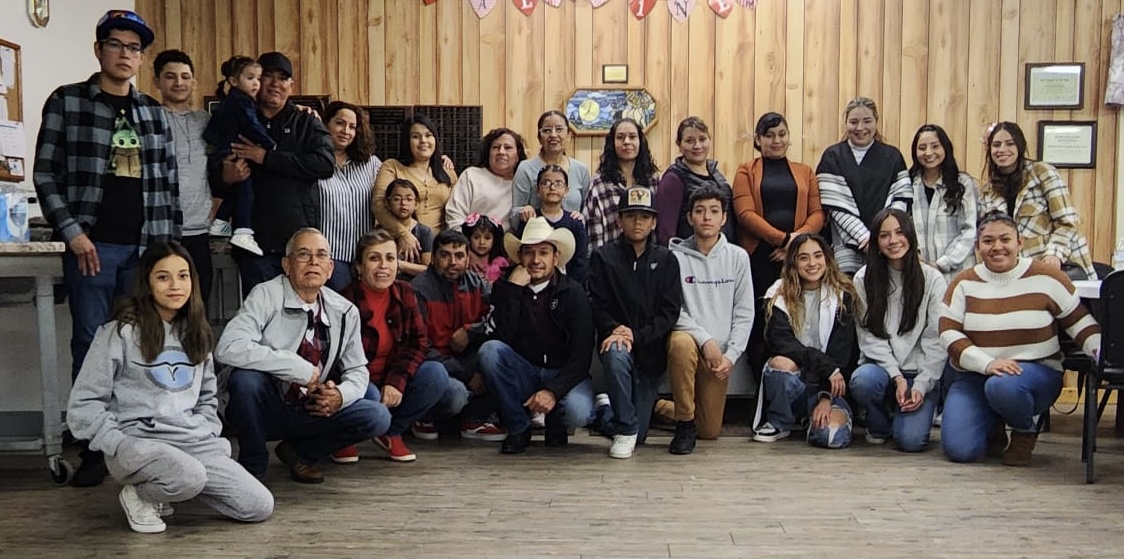 Group of Latino community members pose for a group photo