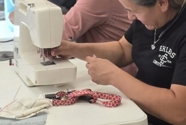 Four women sewing together