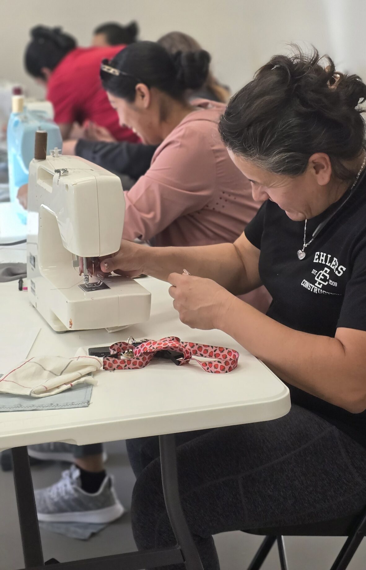 Four women sewing together
