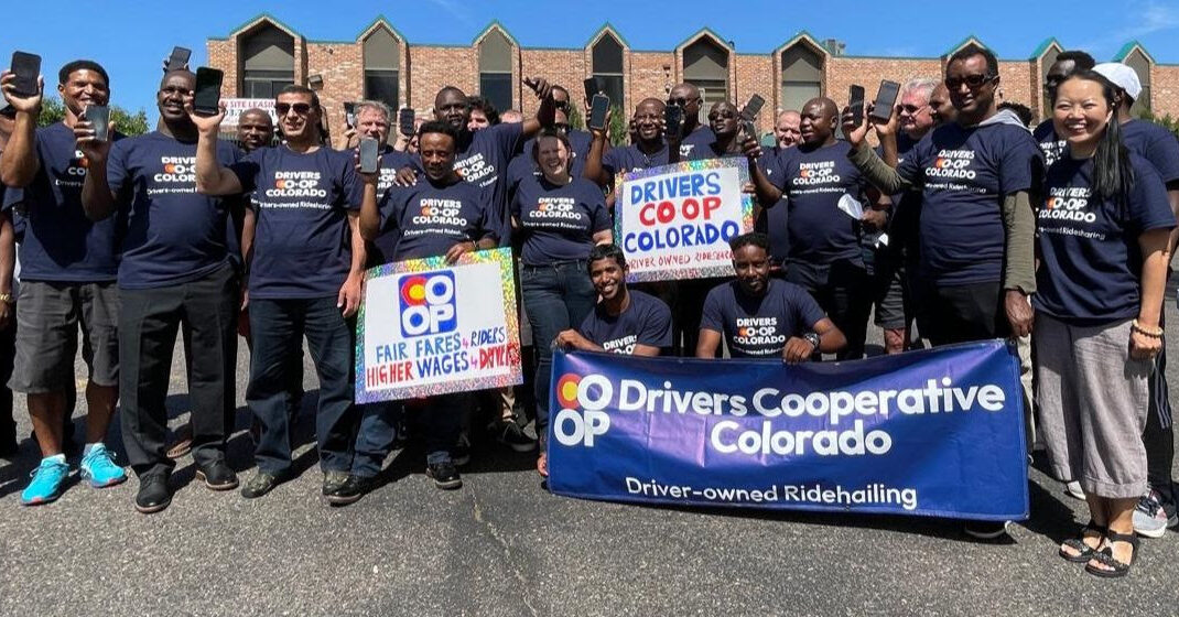 Group of rideshare drivers holding up cell phones